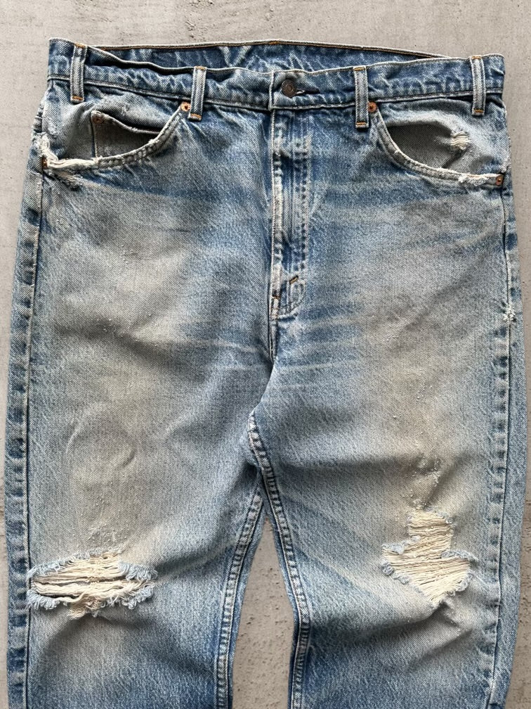 90s Levi’s 505 Distressed Orange Tab Denim Jeans -